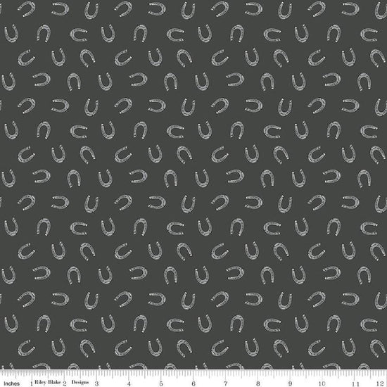 Image of the Cowboys Horseshoes Granite quilting cotton fabric by Echo Park Paper Co for Riley Blake Designs. Features horseshoes on a dark grey background.
Cute Little Fabric Shop