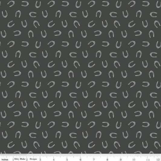Image of the Cowboys Horseshoes Granite quilting cotton fabric by Echo Park Paper Co for Riley Blake Designs. Features horseshoes on a dark grey background.
Cute Little Fabric Shop