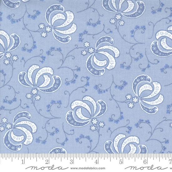 Image of the Hollyhocks Roses Bloom Sky quilting cotton fabric by Moda Fabrics. Features flowers and leaves on a blue lavendar background. 
Cute Little Fabric Shop