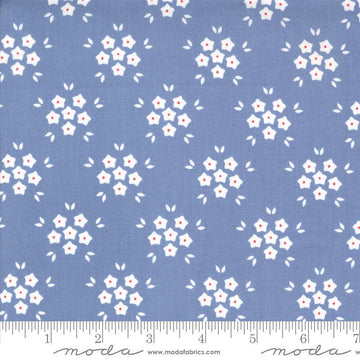 Image of the Hollyhocks Roses Puffs Sky quilting cotton fabric by Moda Fabrics. Features small flowers on a blue background. 
Cute Little Fabric Shop