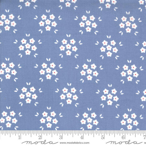 Image of the Hollyhocks Roses Puffs Sky quilting cotton fabric by Moda Fabrics. Features small flowers on a blue background. 
Cute Little Fabric Shop