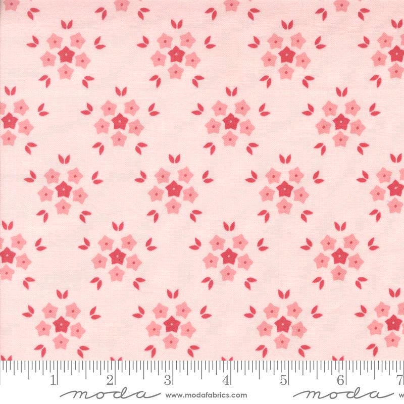 Image of the Hollyhocks Roses Puffs Hollyhock Pink quilting cotton fabric by Moda Fabrics. Features small flowers on a pink background. 
Cute Little Fabric Shop