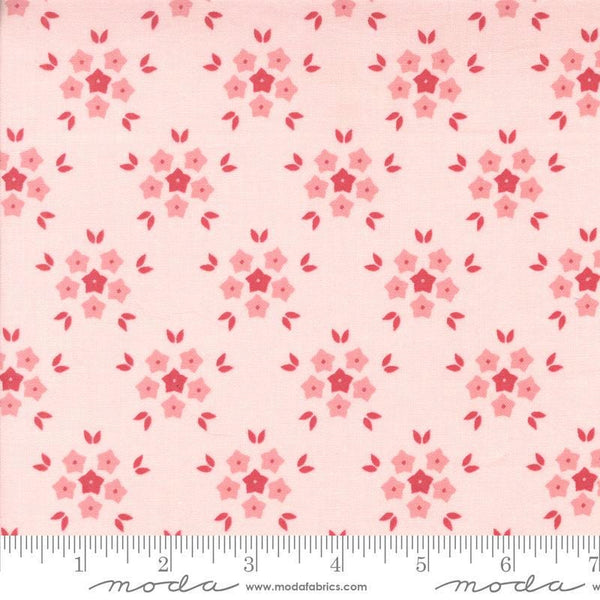 Image of the Hollyhocks Roses Puffs Hollyhock Pink quilting cotton fabric by Moda Fabrics. Features small flowers on a pink background. 
Cute Little Fabric Shop