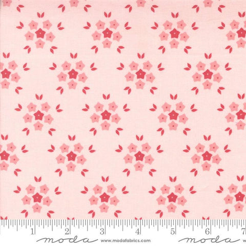 Image of the Hollyhocks Roses Puffs Hollyhock Pink quilting cotton fabric by Moda Fabrics. Features small flowers on a pink background. 
Cute Little Fabric Shop