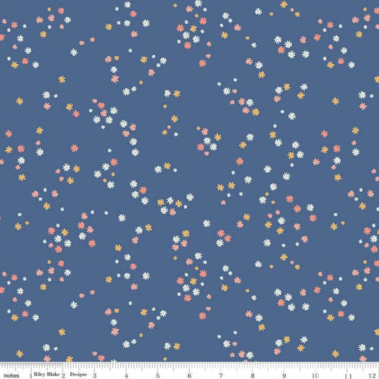 Image of the Between the Pages Flowers Denim quilting cotton fabric by Fran Gulick for Riley Blake Designs. Features scattered small flowers on a blue background. 
Cute Little Fabric Shop