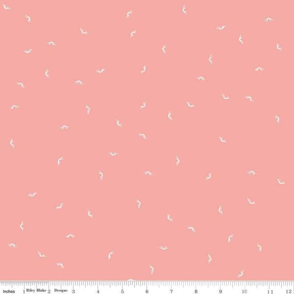 Image of the Between the Pages Open Book Coral
 quilting cotton fabric by Fran Gulick for Riley Blake Designs. Features scattered books on a light pink background. 
Cute Little Fabric Shop
