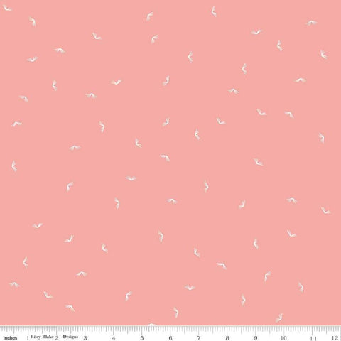 Image of the Between the Pages Open Book Coral
 quilting cotton fabric by Fran Gulick for Riley Blake Designs. Features scattered books on a light pink background. 
Cute Little Fabric Shop