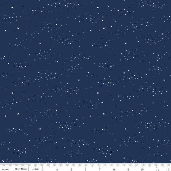Image of the Between the Pages Starlight Navy quilting cotton fabric by Fran Gulick for Riley Blake Designs. Features small scattered stars on a dark blue background. 
Cute Little Fabric Shop