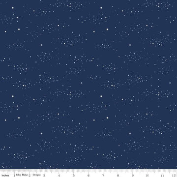 Image of the Between the Pages Starlight Navy quilting cotton fabric by Fran Gulick for Riley Blake Designs. Features small scattered stars on a dark blue background. 
Cute Little Fabric Shop