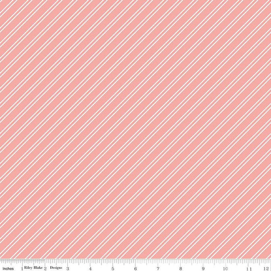 Image of the Between the Pages Stripes Coral quilting cotton fabric by Fran Gulick for Riley Blake Designs. Features diagonal small stripes on a light pink background. 
Cute Little Fabric Shop