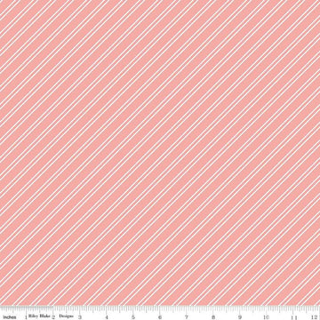 Image of the Between the Pages Stripes Coral quilting cotton fabric by Fran Gulick for Riley Blake Designs. Features diagonal small stripes on a light pink background. 
Cute Little Fabric Shop