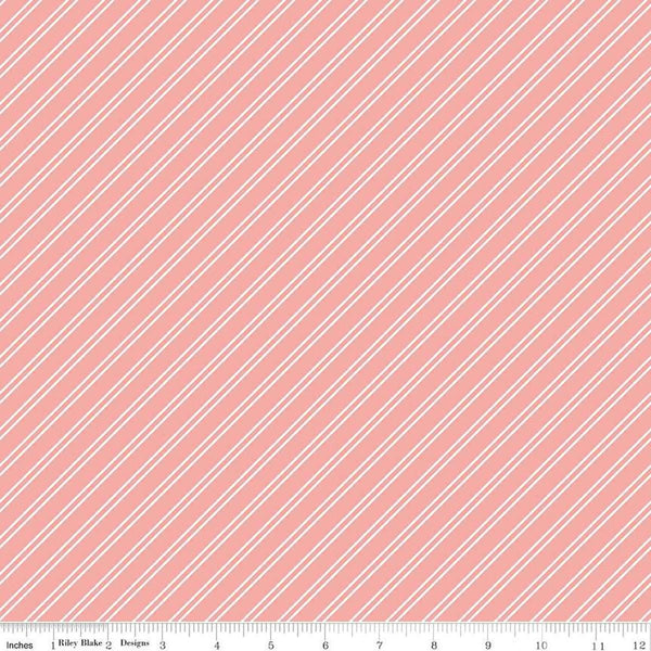 Image of the Between the Pages Stripes Coral quilting cotton fabric by Fran Gulick for Riley Blake Designs. Features diagonal small stripes on a light pink background. 
Cute Little Fabric Shop