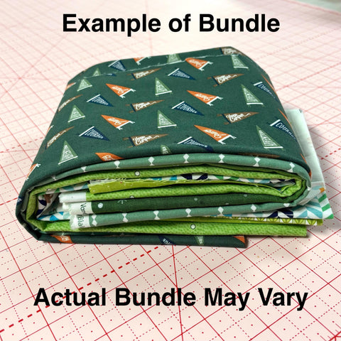 Image of a green mystery bundle using quilting cotton fabric by Riley Blake Designs. Features a green bundle. 
Cute Little Fabric Shop