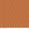 Image of spice, orange-brown colored Riley Blake quilting cotton fabric from the Pumpkin Spice collection. Scattered sparkles on an orange background. 
Cute Little Fabric Shop