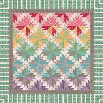 Image of the Indian Summer in Autumn quilt pattern by Quiltworx for Riley Blake Designs. Features a star pattern on a multicolored quilt.