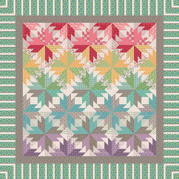 Image of the Indian Summer in Autumn quilt pattern by Quiltworx for Riley Blake Designs. Features a star pattern on a multicolored quilt.