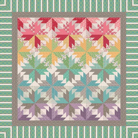 Image of the Indian Summer in Autumn quilt pattern by Quiltworx for Riley Blake Designs. Features a star pattern on a multicolored quilt.
