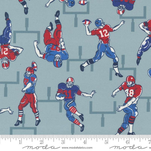 Image of the Play Ball Players Dolphin quilting cotton fabric by Moda Fabrics. Features novelty football players scattered on a blue background. 
Cute Little Fabric Shop