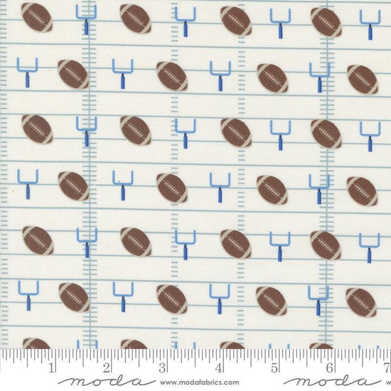 Image of the Play Ball Football Chalk quilting cotton fabric by Moda Fabrics. Features novelty goal posts and footballs on a cream background. 
Cute Little Fabric Shop