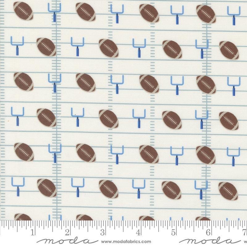 Image of the Play Ball Football Chalk quilting cotton fabric by Moda Fabrics. Features novelty goal posts and footballs on a cream background. 
Cute Little Fabric Shop