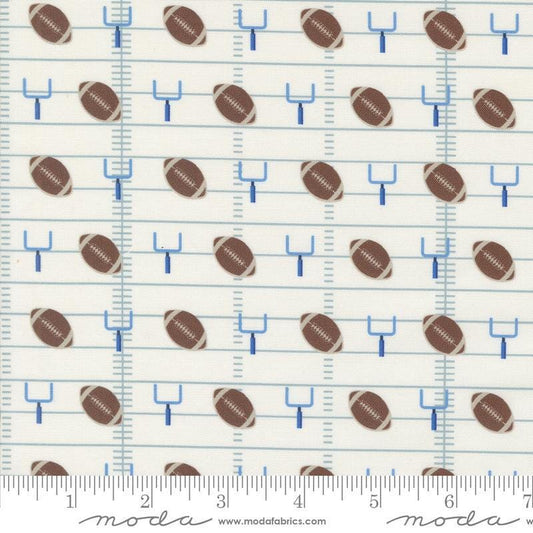 Image of the Play Ball Football Chalk quilting cotton fabric by Moda Fabrics. Features novelty goal posts and footballs on a cream background. 
Cute Little Fabric Shop
