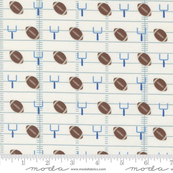 Image of the Play Ball Football Chalk quilting cotton fabric by Moda Fabrics. Features novelty goal posts and footballs on a cream background. 
Cute Little Fabric Shop