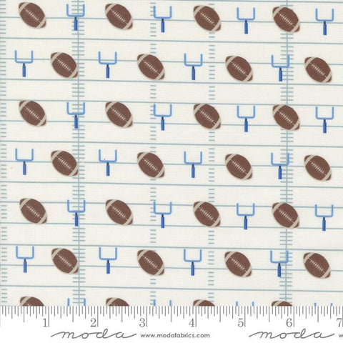 Image of the Play Ball Football Chalk quilting cotton fabric by Moda Fabrics. Features novelty goal posts and footballs on a cream background. 
Cute Little Fabric Shop