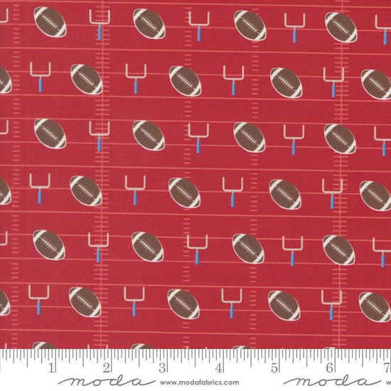 Image of the Play Ball Football Cardinal quilting cotton fabric by Moda Fabrics. Features novelty goal posts and footballs on a red background. 
Cute Little Fabric Shop