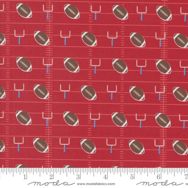 Image of the Play Ball Football Cardinal quilting cotton fabric by Moda Fabrics. Features novelty goal posts and footballs on a red background. 
Cute Little Fabric Shop