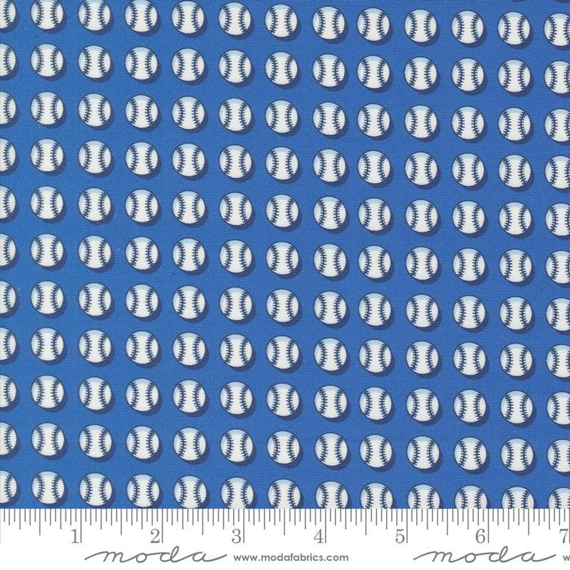 Image of the Play Ball Baseball Bluejay quilting cotton fabric by Moda Fabrics. Features novelty scattered baseballs on a blue background. 
Cute Little Fabric Shop