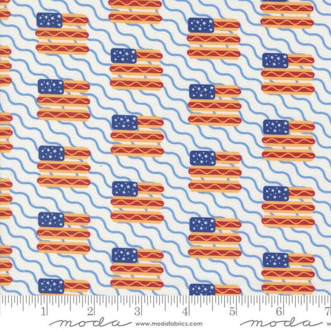 Image of the Play Ball Flags Chalk quilting cotton fabric by Moda Fabrics. Features novelty flags and hotdogs on a cream background. 
Cute Little Fabric Shop