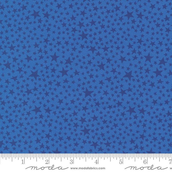 Image of the Play Ball Stars Bluejay quilting cotton fabric by Moda Fabrics. Features novelty stars on a blue background. 
Cute Little Fabric Shop