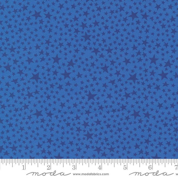 Image of the Play Ball Stars Bluejay quilting cotton fabric by Moda Fabrics. Features novelty stars on a blue background. 
Cute Little Fabric Shop
