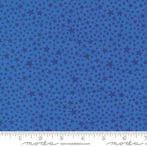 Image of the Play Ball Stars Bluejay quilting cotton fabric by Moda Fabrics. Features novelty stars on a blue background. 
Cute Little Fabric Shop