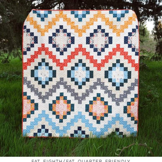 Image of The Stella Quilt Quilt Pattern by Kitchen Table Quilting for Riley Blake Designs. Features a diamond quilt pattern. 
Cute Little Fabric Shop
