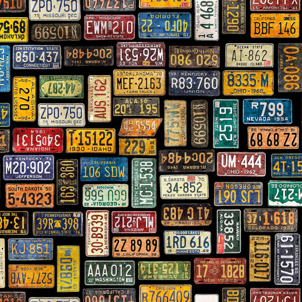 Image of the Heavy Metal License Plates Black J quilting cotton fabric by Morris Creative Group for QT Fabrics. Features small license plates on a black background. 
Cute Little Fabric Shop