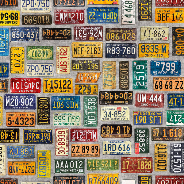 Image of the Heavy Metal License Plates Gray K quilting cotton fabric by Morris Creative Group for QT Fabrics. Features small license plates on a gray background. 
Cute Little Fabric Shop