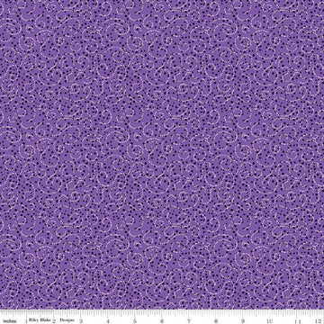 Image of the Plum Petals Swirl Violet quilting cotton fabric by Diane Labombarbe for Riley Blake Designs. Features dotted swirls on a purple background. Cute Little Fabric Shop