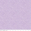 Image of the Plum Petals Swirl Lilac quilting cotton fabric by Diane Labombarbe for Riley Blake Designs. Features dotted swirls on a purple background. Cute Little Fabric Shop