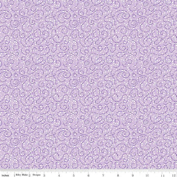 Image of the Plum Petals Swirl Lilac quilting cotton fabric by Diane Labombarbe for Riley Blake Designs. Features dotted swirls on a purple background. Cute Little Fabric Shop