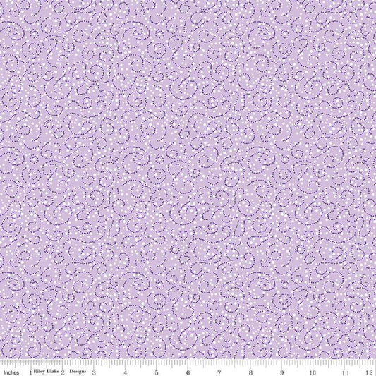 Image of the Plum Petals Swirl Lilac quilting cotton fabric by Diane Labombarbe for Riley Blake Designs. Features dotted swirls on a purple background. Cute Little Fabric Shop