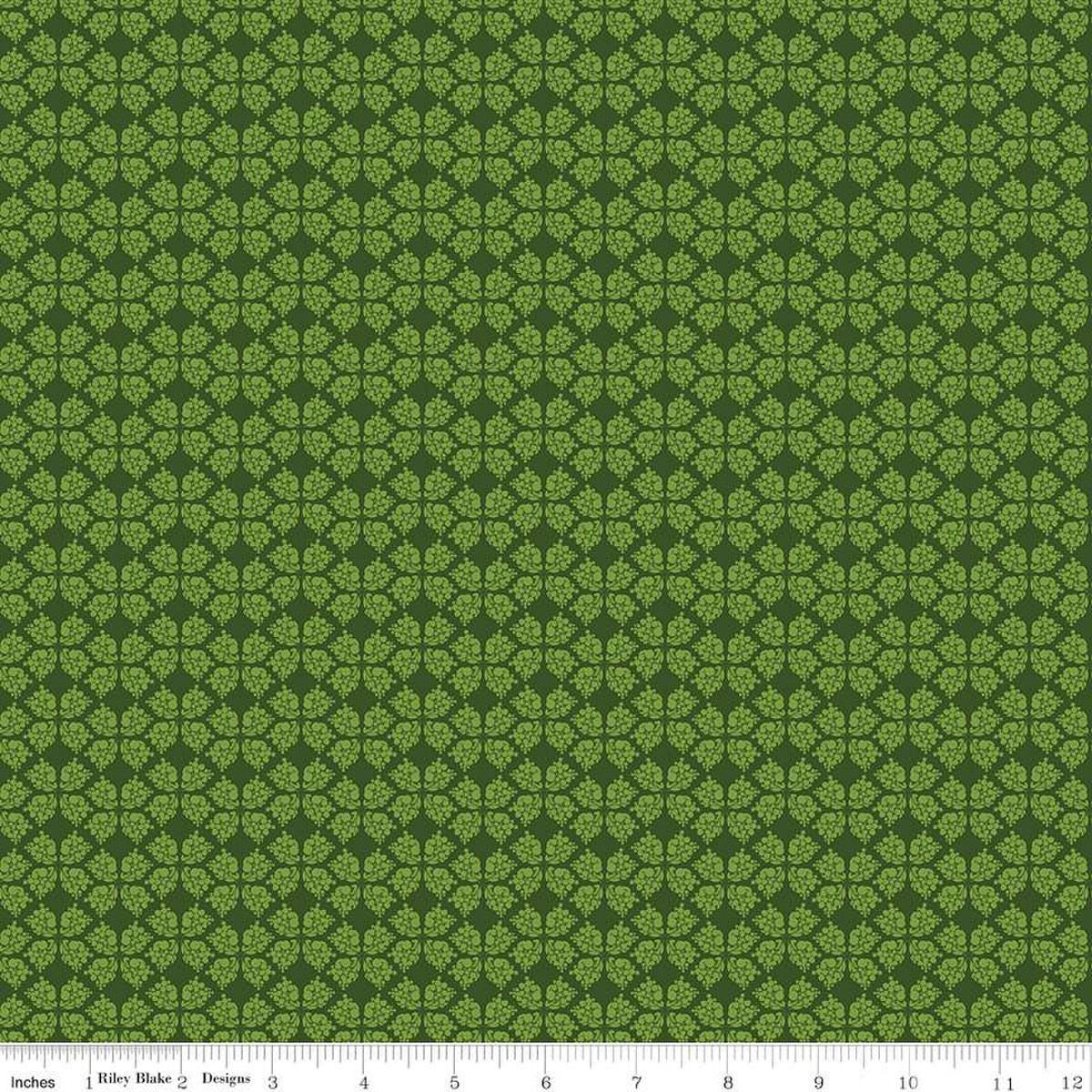 Image of the Plum Petals Geometric Green quilting cotton fabric by Diane Labombarbe for Riley Blake Designs. Features geometric flowers on a green background. Cute Little Fabric Shop