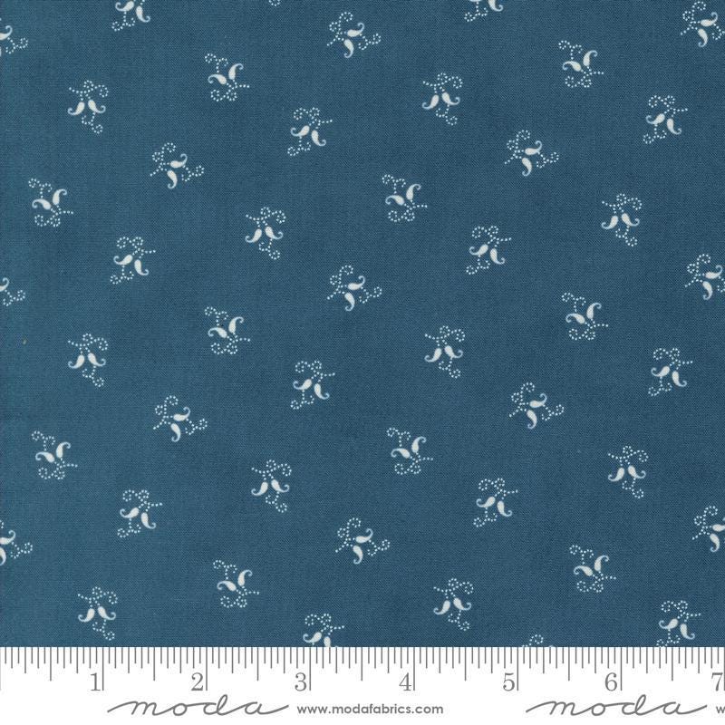 Image of the Sandalwood Felicity Indigo quilting cotton fabric by 3 Sisters for Moda Fabrics. Features a floral fabric on a blue background. Cute Little Fabric Shop
