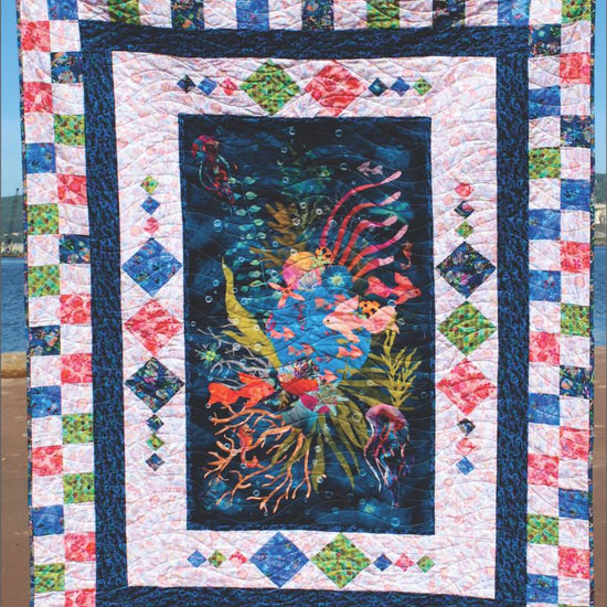 Image of the Panel Bliss quilt pattern. Features a panel in the middle of a quilt pattern. 
Cute Little Fabric Shop