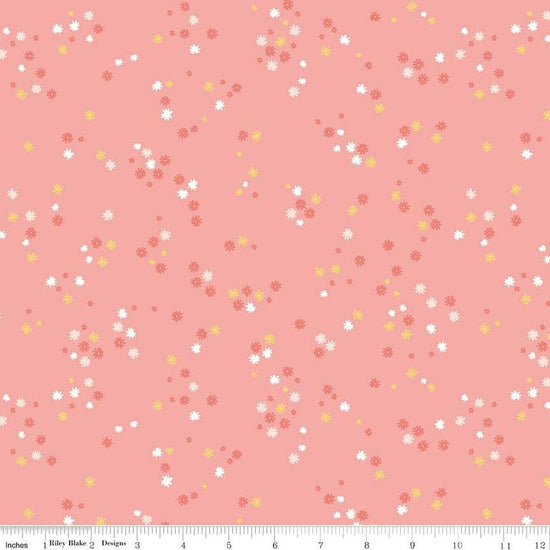 Image of the Between the Pages Flowers Coral quilting cotton fabric by Fran Gulick for Riley Blake Designs. Features scattered small flowers on a pink background. 
Cute Little Fabric Shop