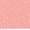 Image of the Between the Pages Flowers Coral quilting cotton fabric by Fran Gulick for Riley Blake Designs. Features scattered small flowers on a pink background. 
Cute Little Fabric Shop