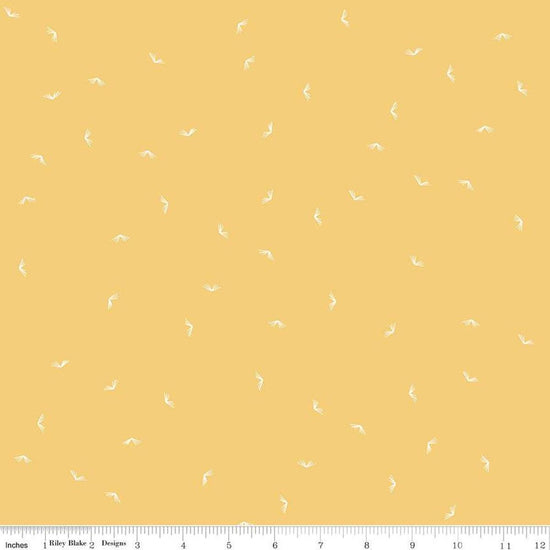Image of the Between the Pages Open Book Honey
 quilting cotton fabric by Fran Gulick for Riley Blake Designs. Features scattered books on a light yellow background. 
Cute Little Fabric Shop