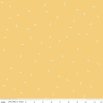 Image of the Between the Pages Open Book Honey
 quilting cotton fabric by Fran Gulick for Riley Blake Designs. Features scattered books on a light yellow background. 
Cute Little Fabric Shop