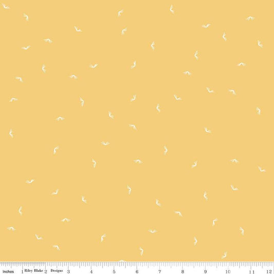Image of the Between the Pages Open Book Honey
 quilting cotton fabric by Fran Gulick for Riley Blake Designs. Features scattered books on a light yellow background. 
Cute Little Fabric Shop