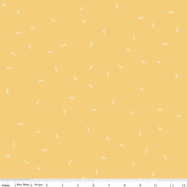 Image of the Between the Pages Open Book Honey
 quilting cotton fabric by Fran Gulick for Riley Blake Designs. Features scattered books on a light yellow background. 
Cute Little Fabric Shop